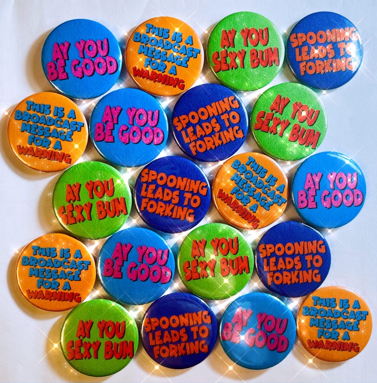 4 pack of slogan pin badge